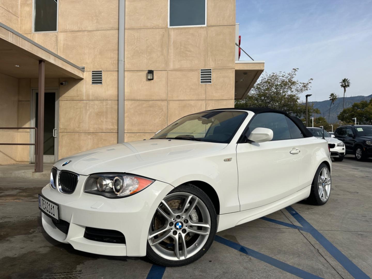 2011 WHITE /Black BMW 1-Series 135i Convertible (WBAUN7C56BV) with an 3.0L L6 DOHC 24V engine, Automatic transmission, located at 30 S. Berkeley Avenue, Pasadena, CA, 91107, (626) 248-7567, 34.145447, -118.109398 - Experience the Ultimate Driving Pleasure: 2011 BMW 135i Convertible Now Available in Pasadena, CA Discover the thrill of open-air driving with the 2011 BMW 135i Convertible, a perfect blend of luxury and performance, now featured at our BHPH dealership in Pasadena, CA. This exquisite convertible - Photo#0